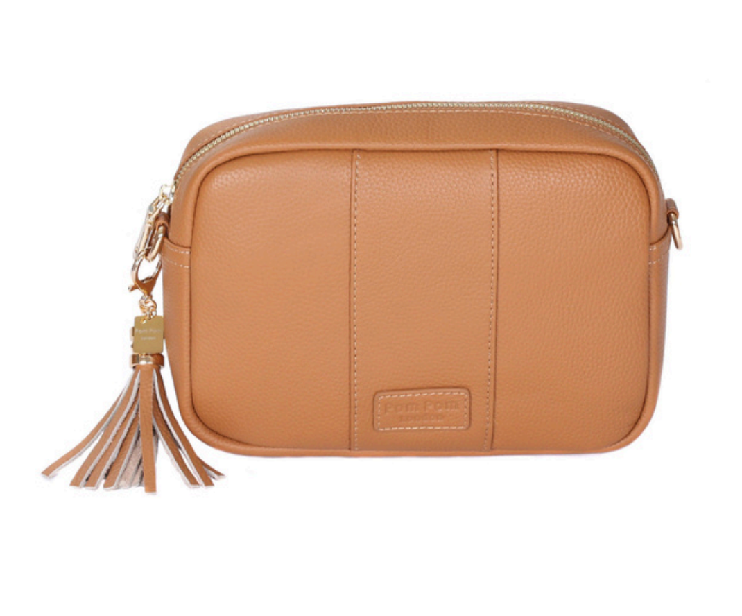 Maple Pom Pom London City Bag – handcrafted leather crossbody with interchangeable straps and London-inspired design. Available at Be Charmed.