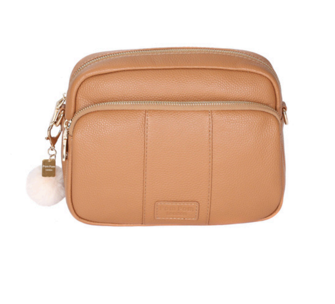 Maple Pom Pom London Original Bag – classic handcrafted leather crossbody with adjustable and interchangeable straps. Available at Be Charmed.
