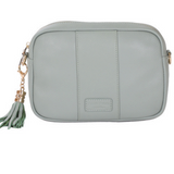 Mint Pom Pom London City Bag – handcrafted leather crossbody with interchangeable straps and London-inspired design. Available at Be Charmed.