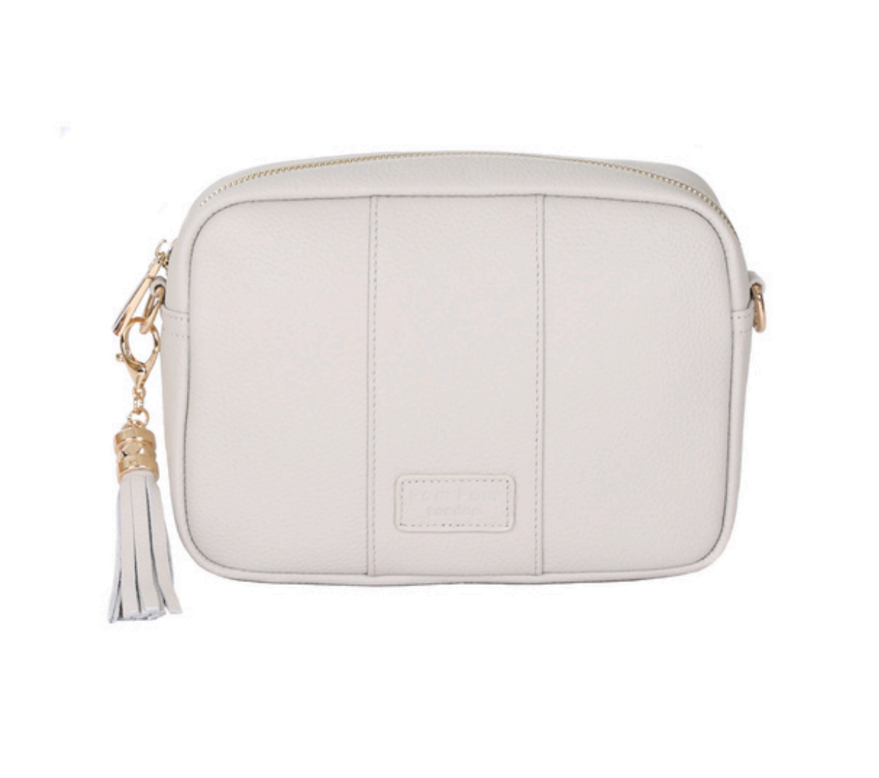 Oatmeal Pom Pom London City Bag – handcrafted leather crossbody with interchangeable straps and London-inspired design. Available at Be Charmed.