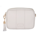 Oatmeal Pom Pom London City Bag – handcrafted leather crossbody with interchangeable straps and London-inspired design. Available at Be Charmed.