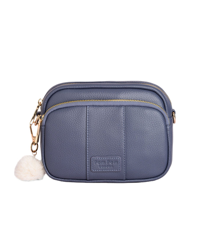 Slate Blue Pom Pom London Original Bag – classic handcrafted leather crossbody with adjustable and interchangeable straps. Available at Be Charmed.