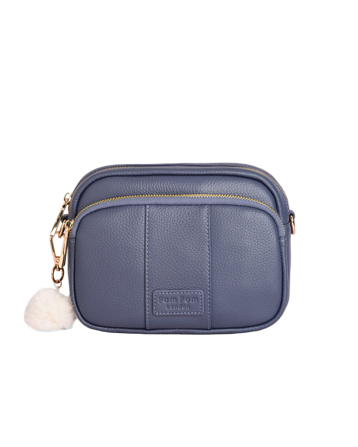 Slate Blue Pom Pom London Original Bag – classic handcrafted leather crossbody with adjustable and interchangeable straps. Available at Be Charmed.
