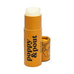 Opened Lip balm with 'Poppy & Pout' branding on a white background. Available at Be Charmed