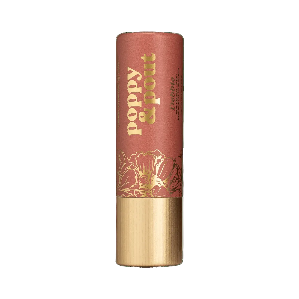  Poppy & Pout Debbie Lip balm with gold text and floral design on a background. Available at Be Charmed