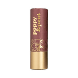  Poppy & Pout Donna Lip balm with gold text and floral design on a background. Available at Be Charmed