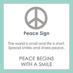 Product card for Lola silver peace sign pendant necklace with classic symbolic design, meaningful everyday jewelry, Available at Be Charmed