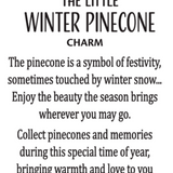 Product card for A small bronze-tone Ganz pinecone charm with white frosted snow tips and green holly detailing on top. Available at Be Charmed