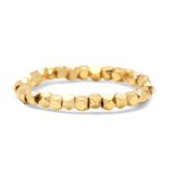 A {ura Vida gold faceted bead stretch ring on a white background. Available at Be Charmed