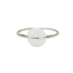 A Pura Vida silver ring with a white opal stone in the center, with a brass base and white rhodium plating. Available at Be Charmed