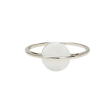 A Pura Vida silver ring with a white opal stone in the center, with a brass base and white rhodium plating. Available at Be Charmed