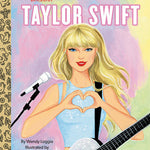 Cover of the Little Golden Book biography about Taylor Swift, featuring an illustration of the singer with a guitar and a heart shape. Available at Be Charmed