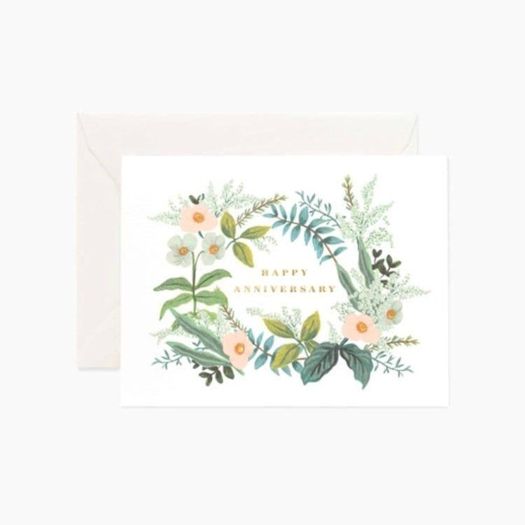 Greeting card with floral design and 'Happy Anniversary' text on a white background. Available at Be Charmed