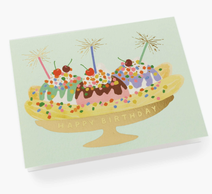 A colorful Rifle Paper Co. Banana Split birthday card with a cheerful, cherry-topped dessert illustration, available at Be Charmed.