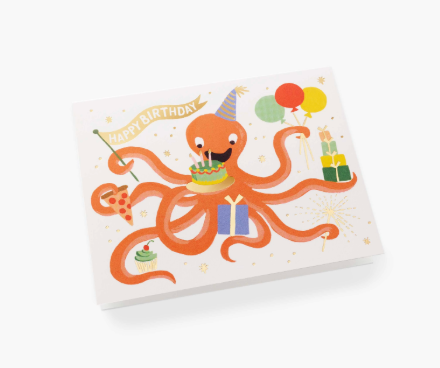 A whimsical Rifle Paper Co. Octopus birthday card featuring a festive marine friend juggling party treats, available at Be Charmed.