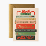 Christmas-themed greeting card with book design and envelope on a white background. Available at Be Charmed