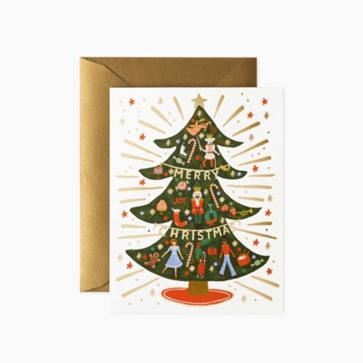 Christmas card with a decorated tree and 'Merry Christmas' text, featuring a gold envelope. Available at Be Charmed
