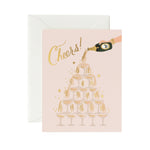 Shop the Rifle Paper Co. Champagne Tower cheers card at Be Charmed. This elegant, foil-accented card is perfect for any celebration.