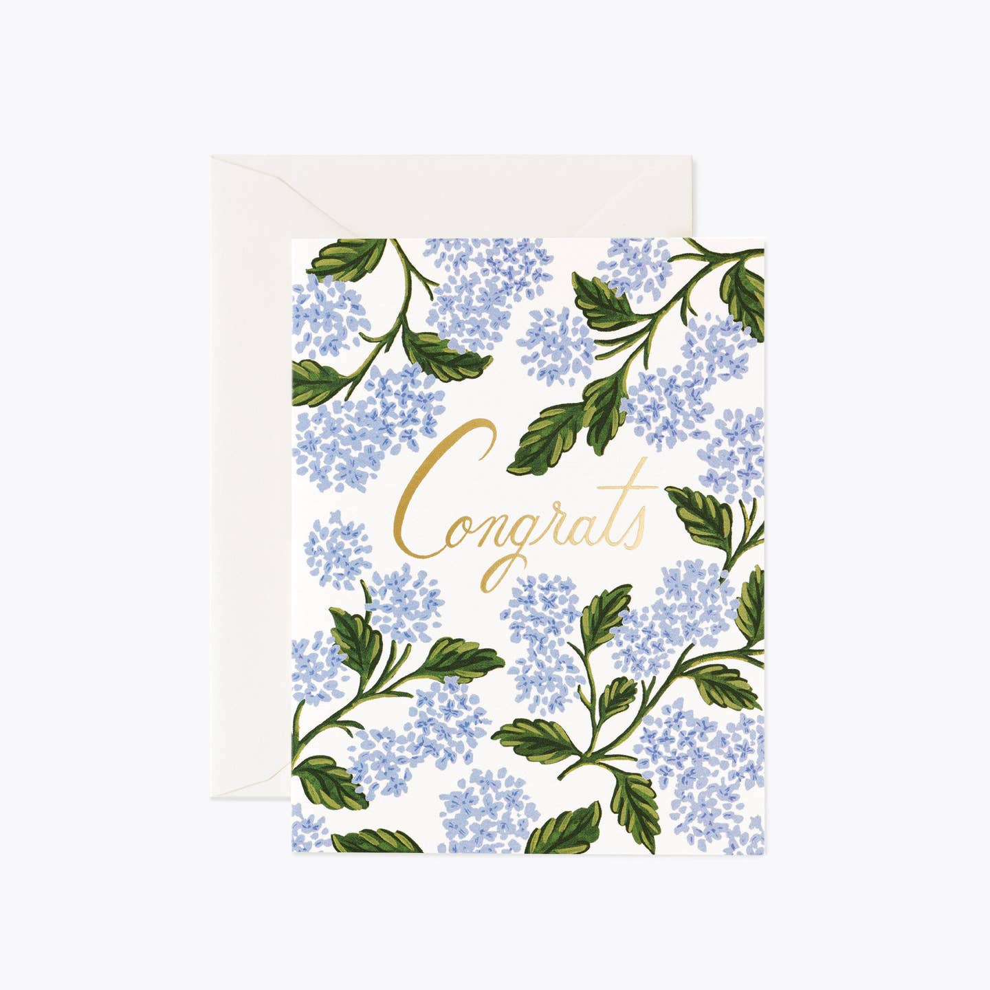 A congratulatory greeting card with a floral pattern and the word 'Congrats' written in a prominent font, accompanied by a white envelope. Available at Be Charmed