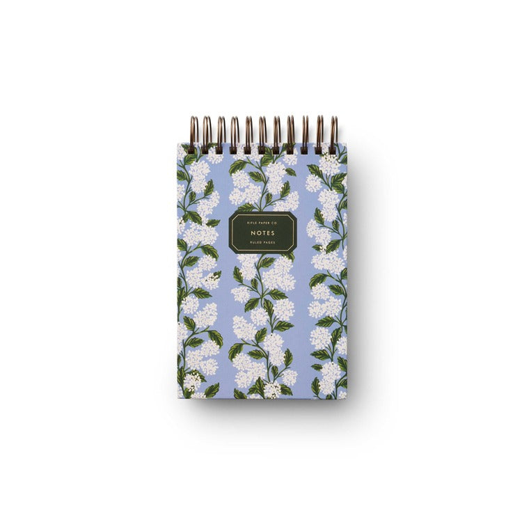 Notebook with floral design on a white background. Available at Be Charmed