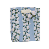 Floral-patterned gift bag on a white background. Available at Be Charmed