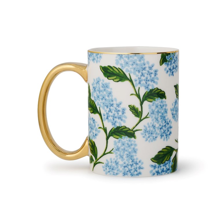 Mug with floral design and gold handle on a white background.  Available at Be Charmed