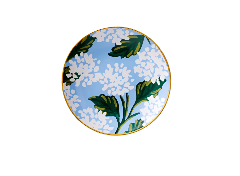 A porcelain ring dish with a gold rim featuring a floral pattern of hydrangeas. Available at Be Charmed