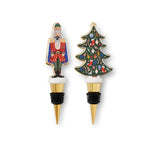 Nutcracker and Christmas tree porcelain wine stoppers with gold accents—Available at Be Charmed