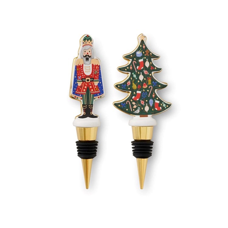 Nutcracker and Christmas tree porcelain wine stoppers with gold accents—Available at Be Charmed