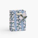 A premium Rifle Paper Co. small gift bag featuring hand-painted pink hydrangea florals and soft ribbon handles, available at Be Charmed.