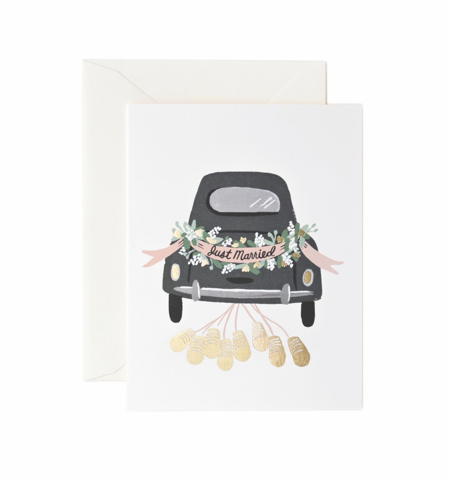 A greeting card with a vintage car illustration covered in wedding decorations, such as flowers and ribbons, with a 'Just Married' sign on the back. Available at Be Charmed
