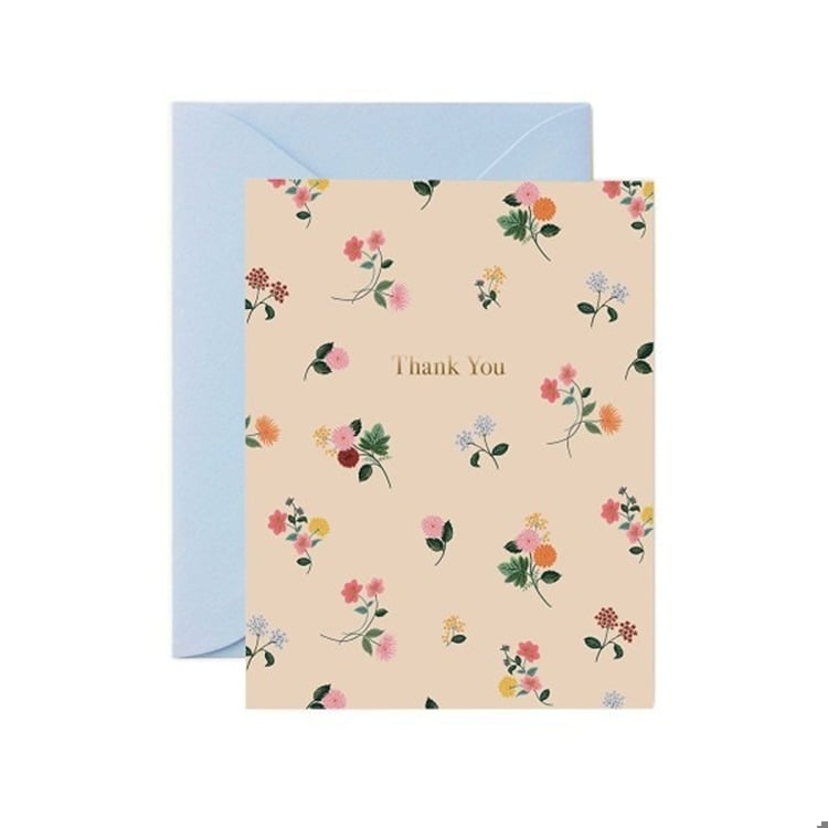 Floral patterned card with 'Thank You' text and a light blue envelope on a white background.  Available at Be Charmed