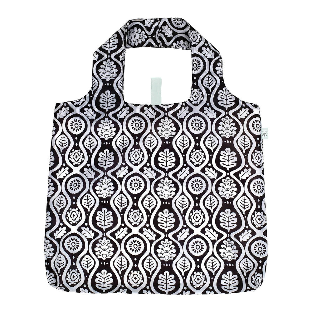 Black and white patterned reusable shopping bag on a white background. Available at Be Charmed