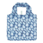 Foldable shopping bag with blue leaf pattern on a white background. Available at Be Charmed