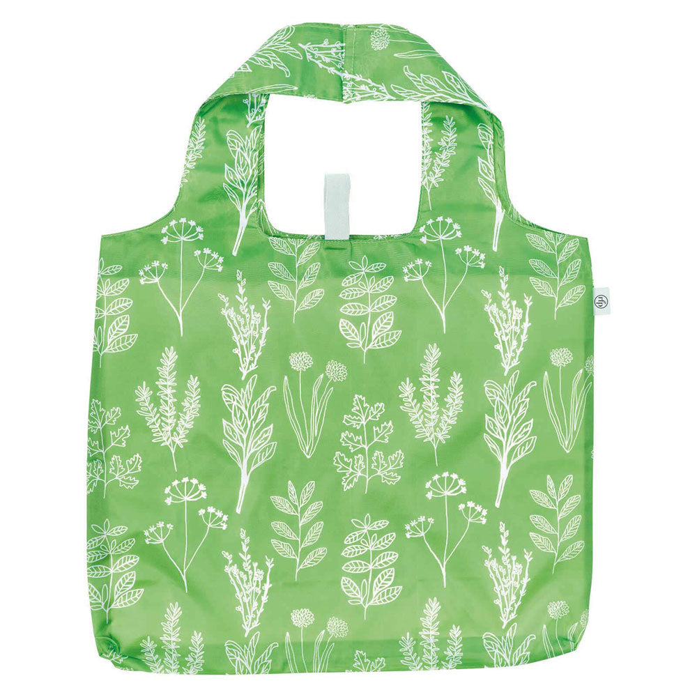 Green reusable bag with white floral pattern on a white background. Available at Be Charmed