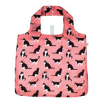 Pink tote bag with black cat pattern on a white background. Available at Be Charmed