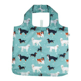 Foldable shopping bag with dog pattern on a teal background. Available at Be Charmed