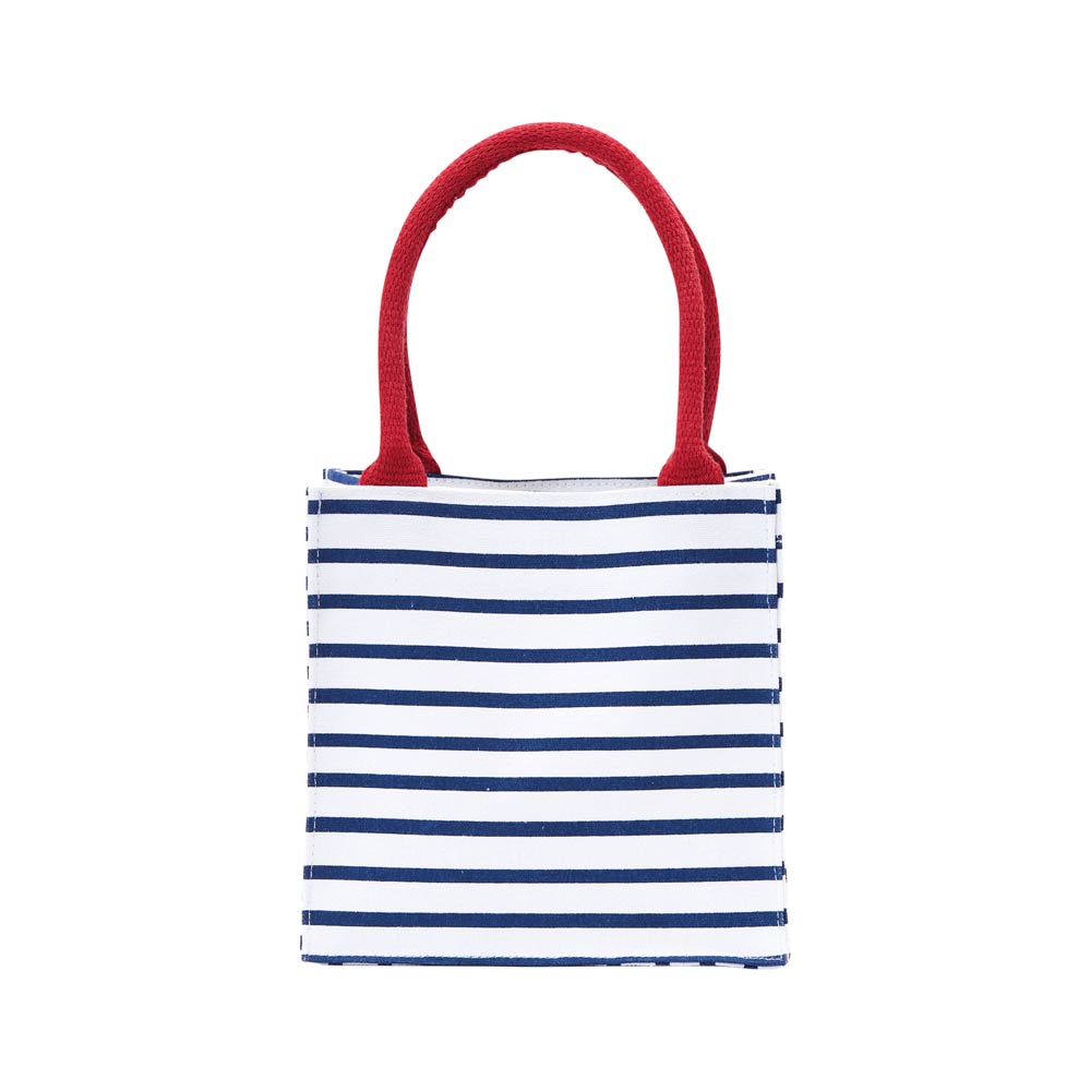 Striped tote bag with red handles on a white background. Available at Be Charmed