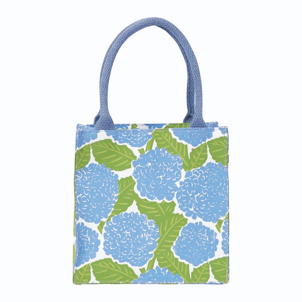 Tote bag with blue floral pattern on a white background. Available at Be Charmed
