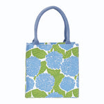 Tote bag with blue floral pattern on a white background. Available at Be Charmed