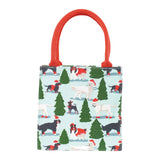 Rock Flower Paper Merry Dog Small bag with Christmas-themed dog pattern and red handle on a white background. Available at Be Charmed