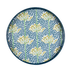 A round decorative tray with a dark blue rim, featuring a pattern of yellow and white flowers with green stems on a blue speckled background. Available at Be Charmed