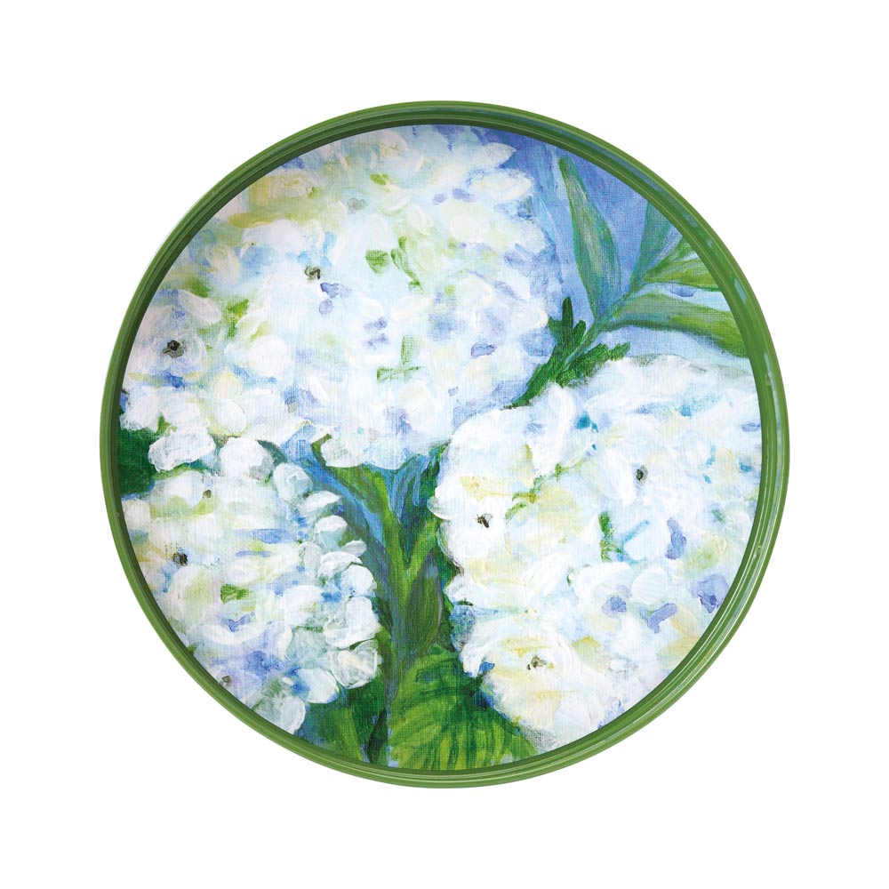 Round ceramic plate with white floral design on a green border. Available at Be Chamred