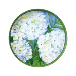 Round ceramic plate with white floral design on a green border. Available at Be Chamred