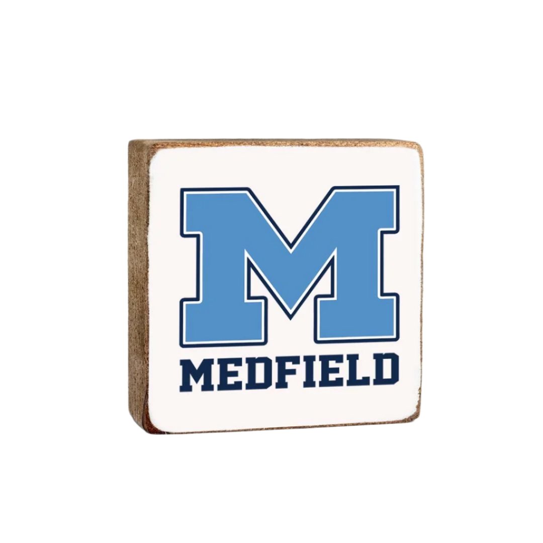 A Rustic Marlin wooden decorative block with 'MEDFIELD' and a blue 'M' on it, indicating a rustic home decor item. Available at Be Caharmed