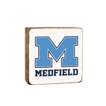 A Rustic Marlin wooden decorative block with 'MEDFIELD' and a blue 'M' on it, indicating a rustic home decor item. Available at Be Caharmed