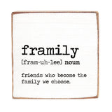 A decorative wooden block with the definition of 'framily' printed on it, indicating it's a noun and friends who become the family we choose. Available at Be Charmed