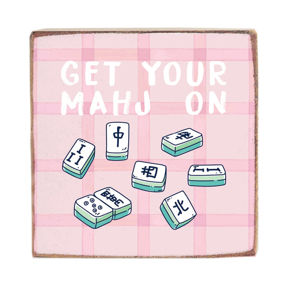 Pink plaid pocket square with cartoonish mahjong tiles and text 'GET YOUR MAHJ ON' on a white background. Available at Be Charmed