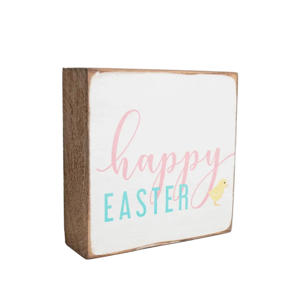 A 6x6 wooden block with 'Happy Easter' text and a duck illustration, painted in a rustic style. Available at Be Charmed