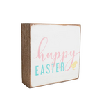 A 6x6 wooden block with 'Happy Easter' text and a duck illustration, painted in a rustic style. Available at Be Charmed